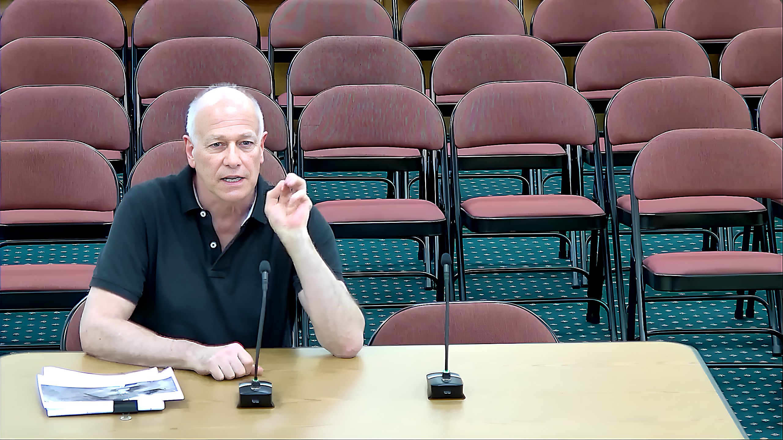 A speaker addresses the commission during discussion of a wetlands activity permit for Lot 2 and Lot 415.