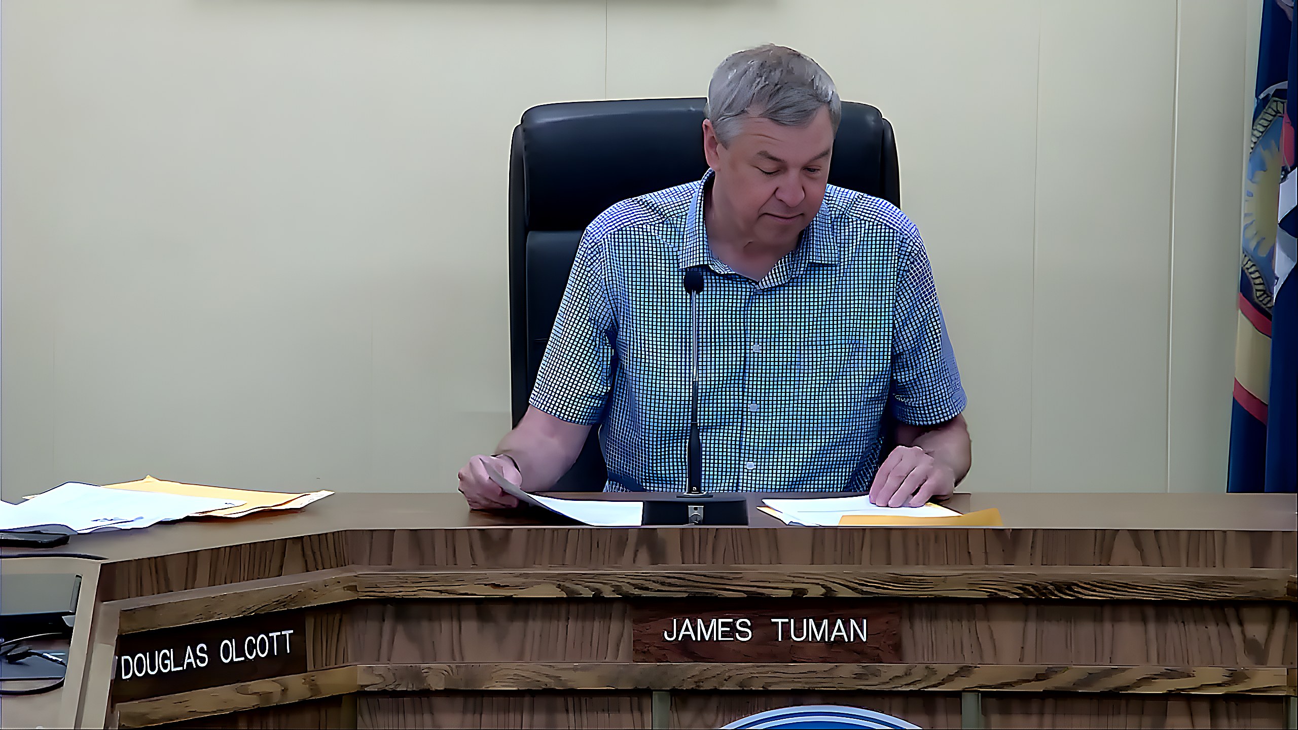James Tuman, Chair of the Zoning Board, reads from the 1931 village code during the meeting