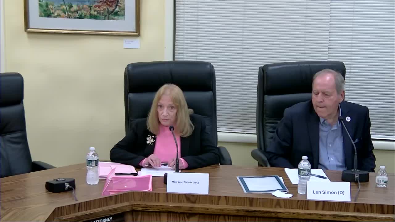 Mary Lynn Dlabola answers a question about accountability at the October 8 LWV forum, with Len Simon seated beside her.